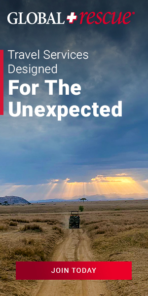 global rescue ad featuring an image of a truck driving on a dirt road