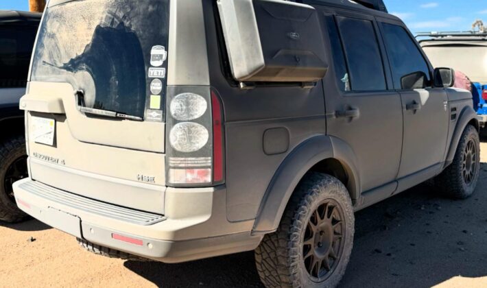 photo of a Land Rover LR4 covered in dust