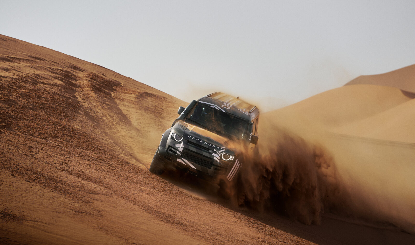 Land Rover Defender Octa Dakar vehicle driving in desert