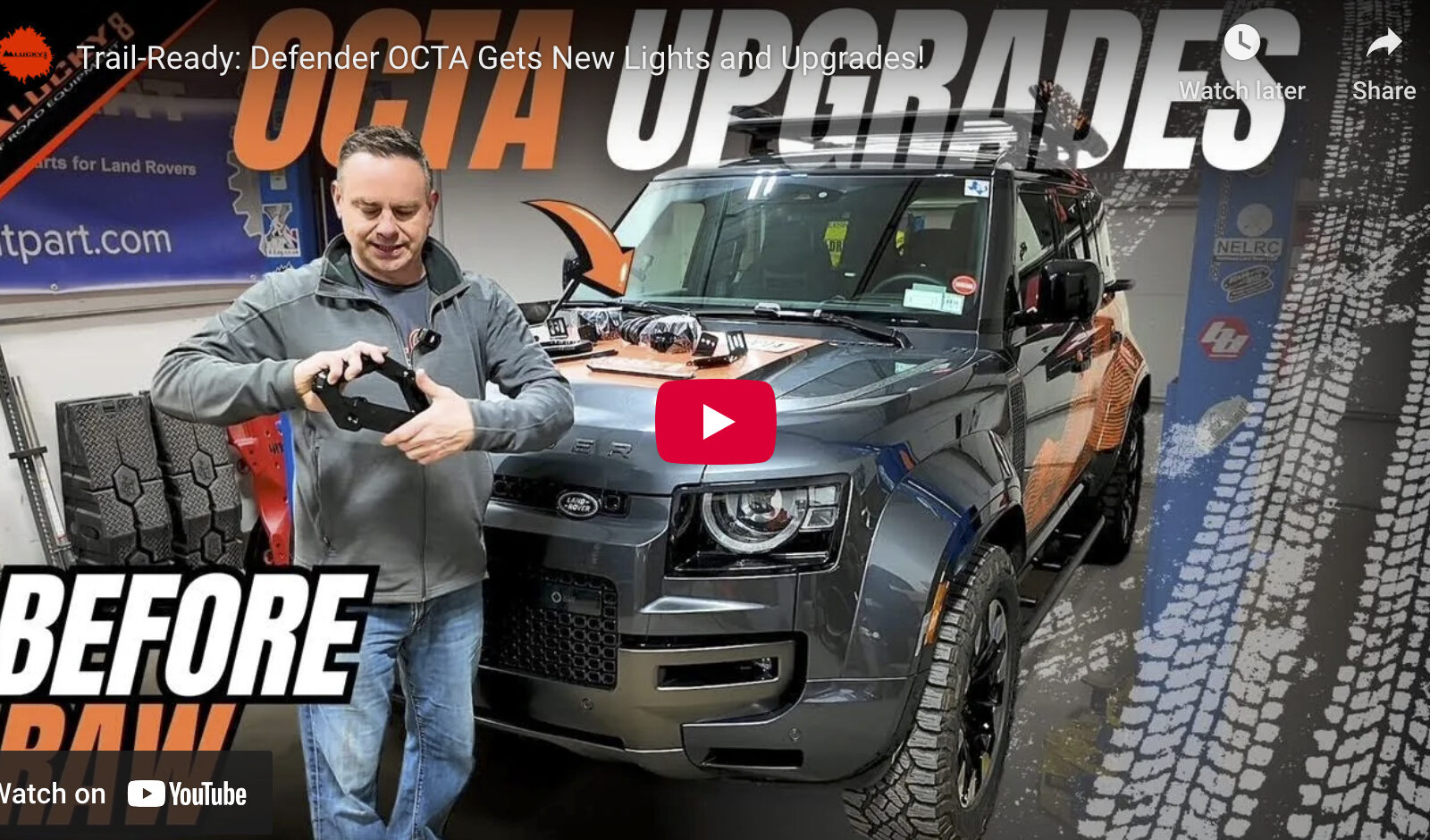 video cover image of a man in front of a Defender in a garage